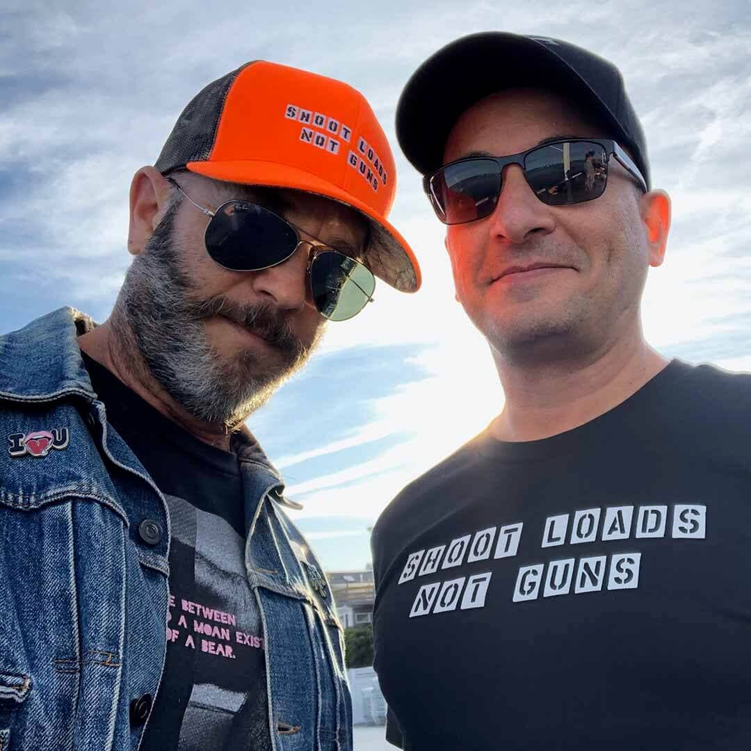 orange shoot loads not guns snapback and black t-shirt