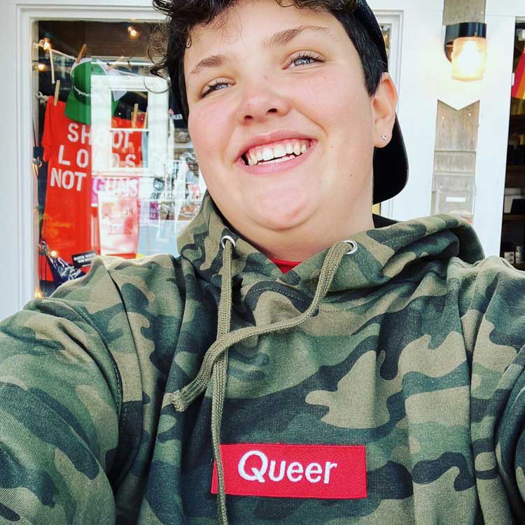 queer camo hooded sweatshirt on boy