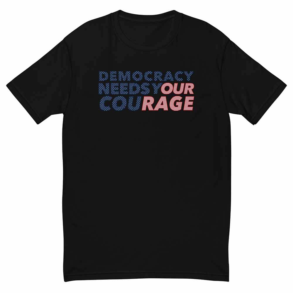 Black t-shirt with colorful text 'Democracy Needs Our Courage' on a white background