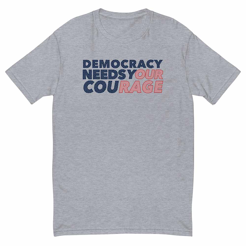 Gray t-shirt with 'Democracy Needs Your Courage' text in blue and red on a white background