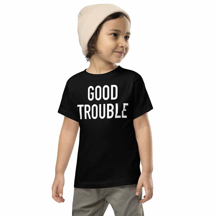 Child wearing a black t-shirt with &