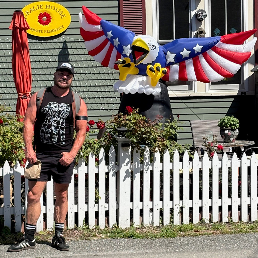 aaron royer wearing jeff miller muscle tee and coming to the cottage hat