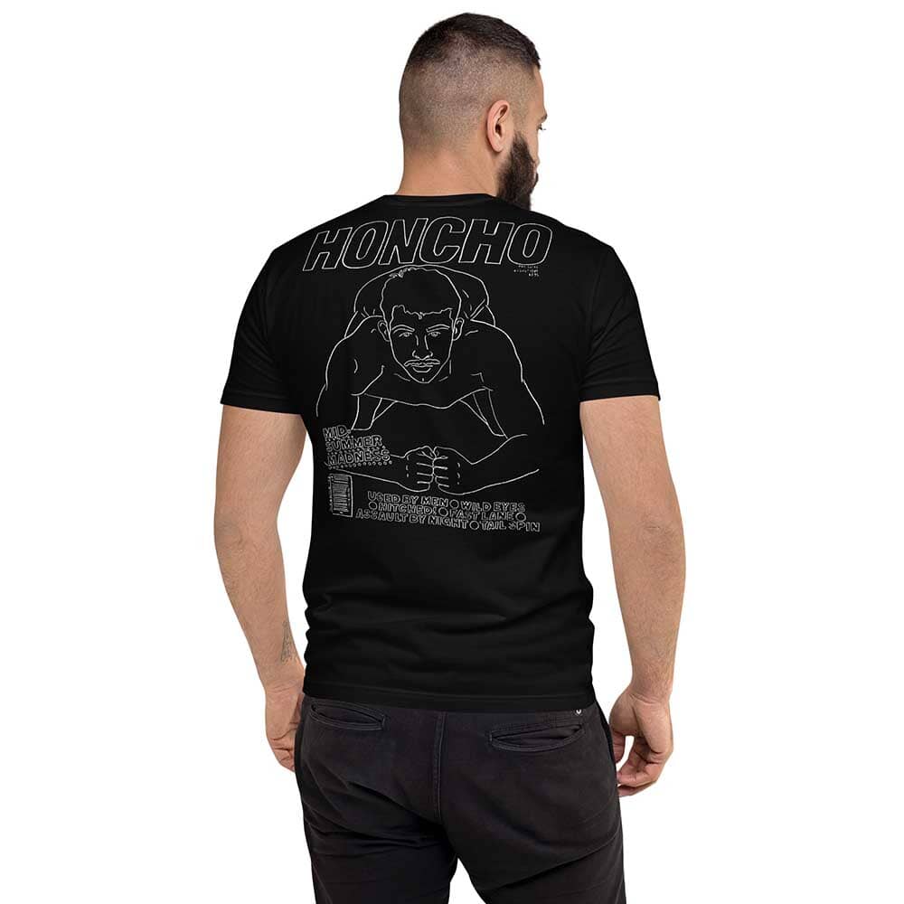 honcho man kneeling white drawing on black tee on man