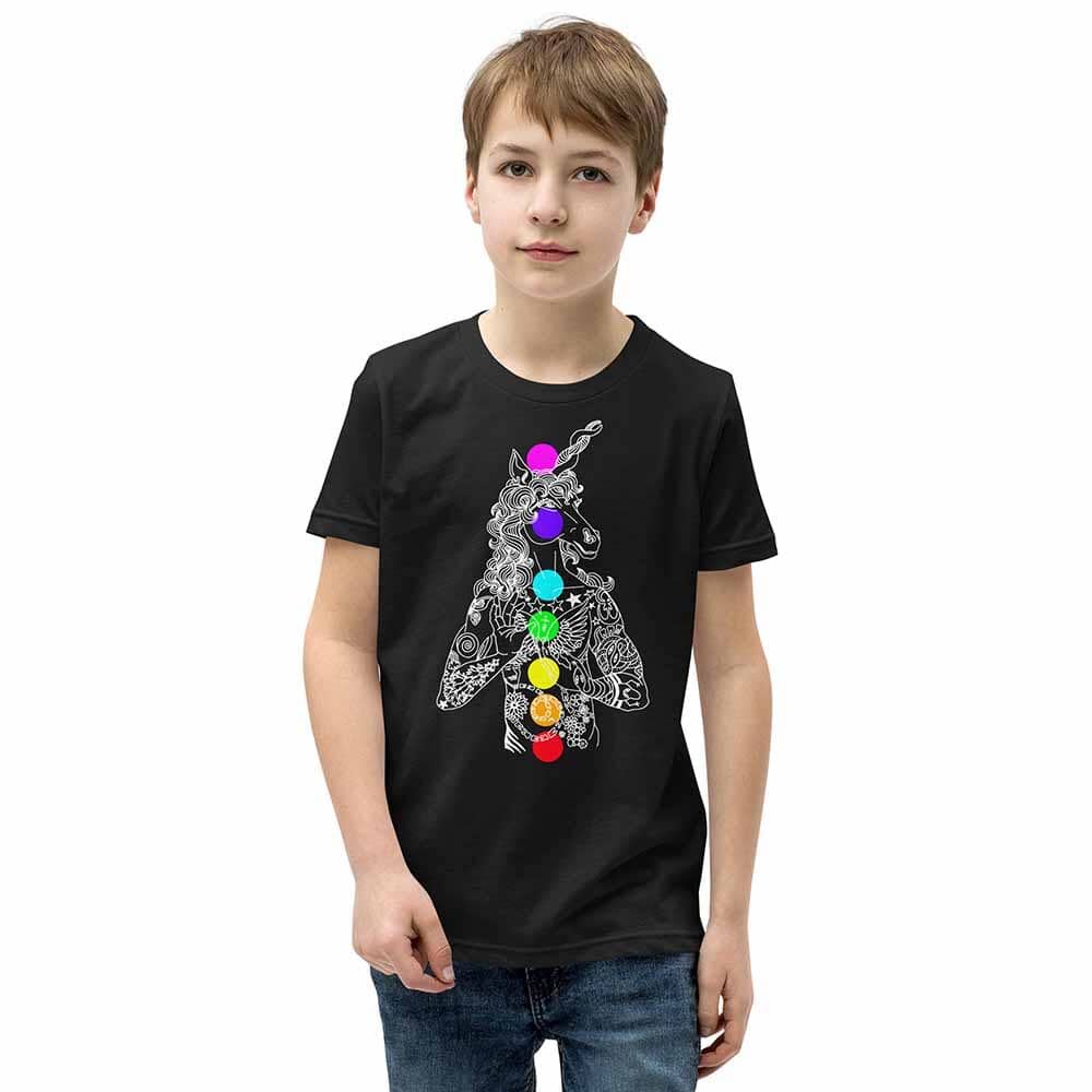 Child wearing a black t-shirt with a colorful unicorn design on a white background