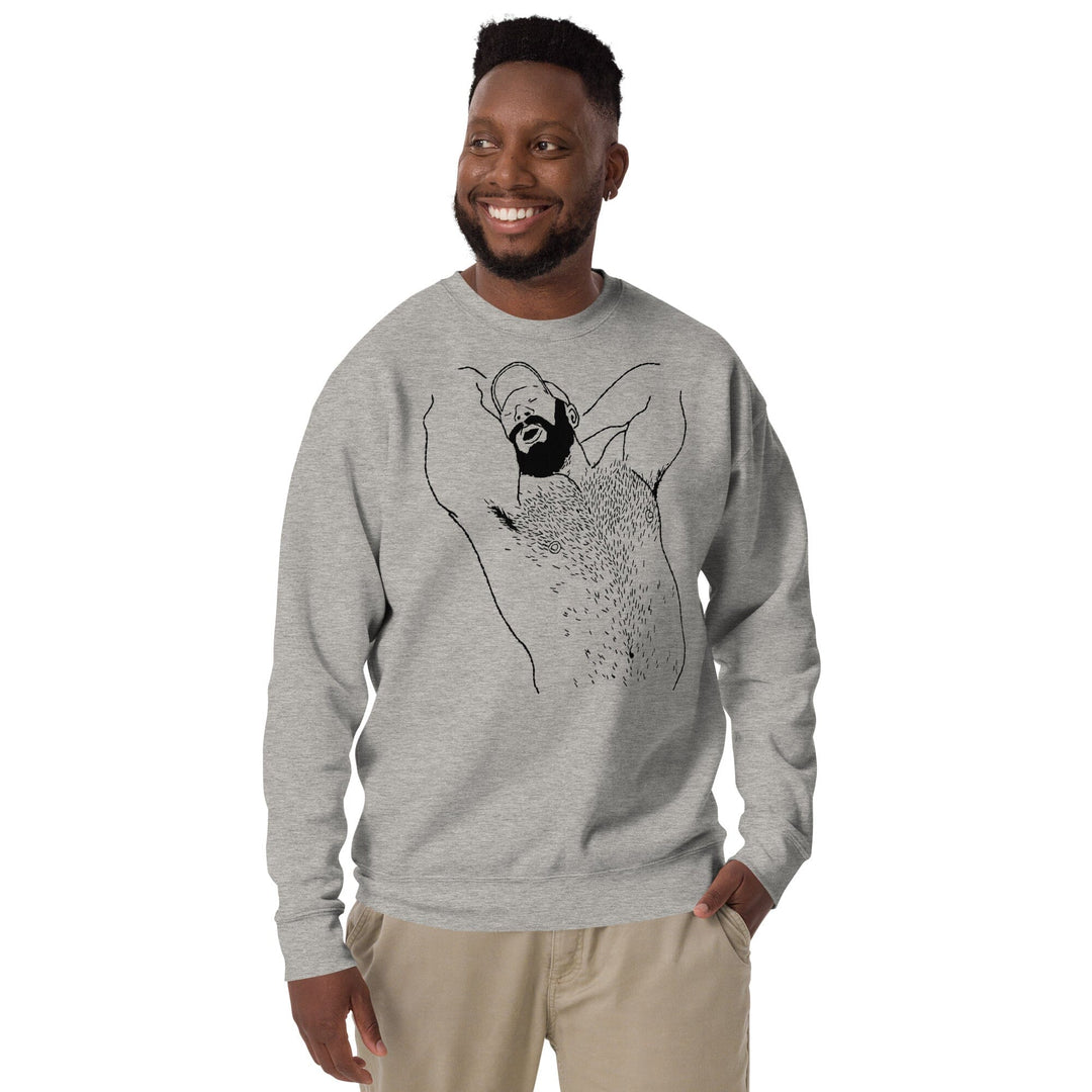 Man wearing carbon grey unisex premium sweatshirt with black queer bear art by Kinky Needles, collaboration with Adam&