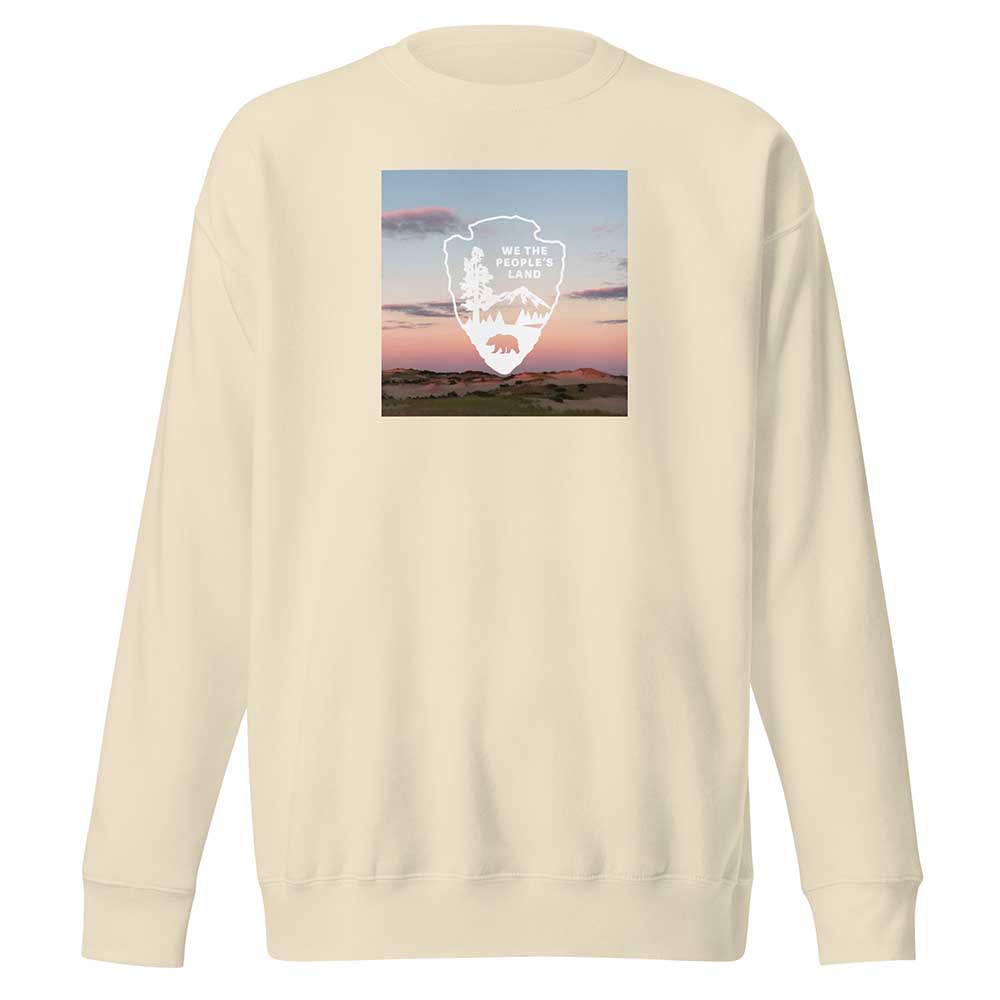 Beige sweatshirt with a graphic design on the back against a white background