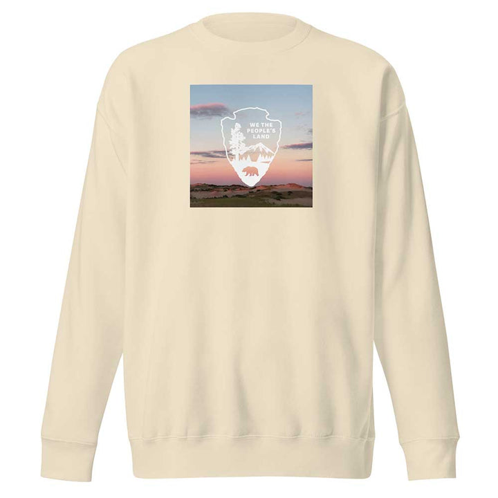 Beige sweatshirt with a graphic design on the back against a white background