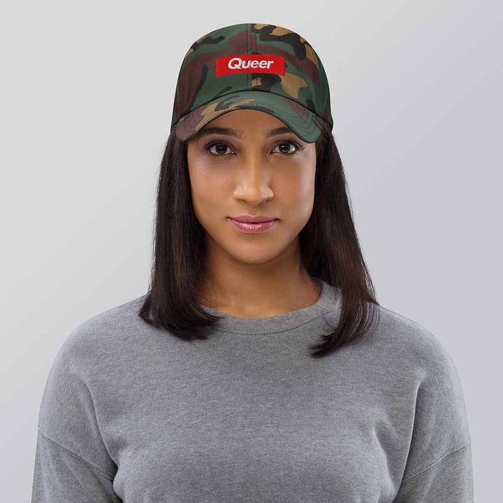 queer camo twill dad hat on woman