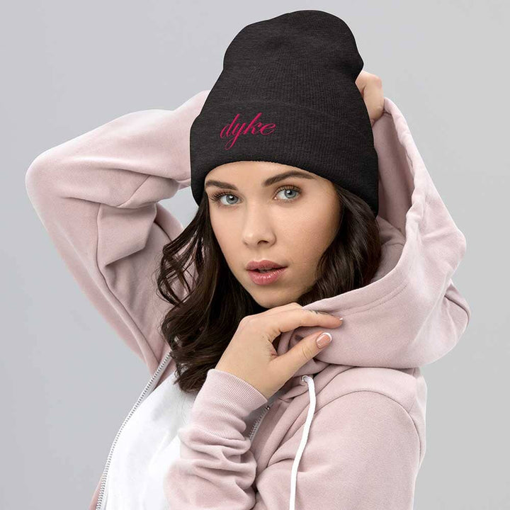 Woman wearing a charcoal grey beanie with &