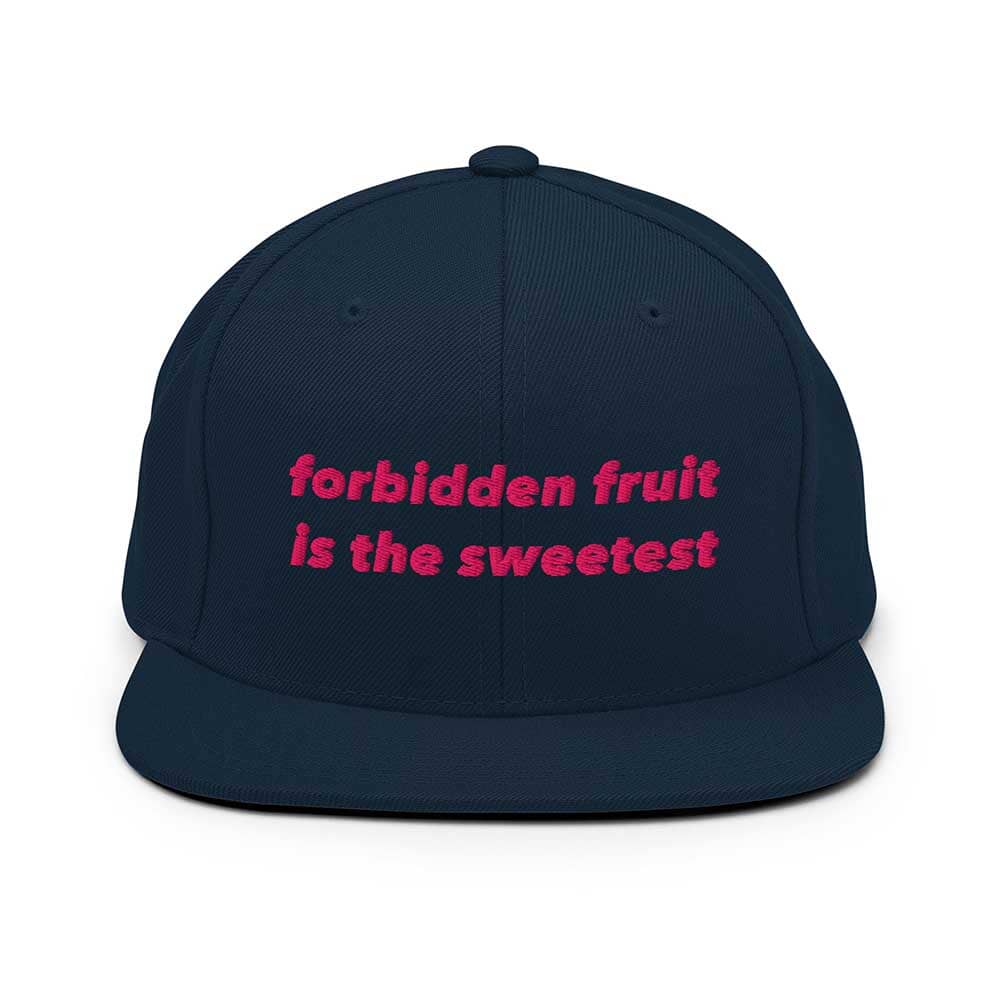 Navy blue flatbill cap with pink text 'forbidden fruit is the sweetest' on a white background