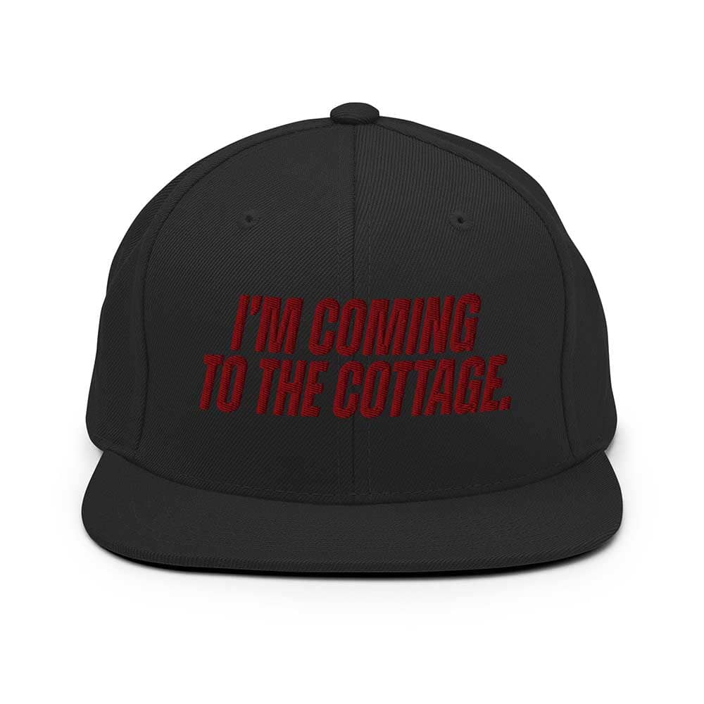 Black cap with red text 'I'm coming to the cottage' on a white background