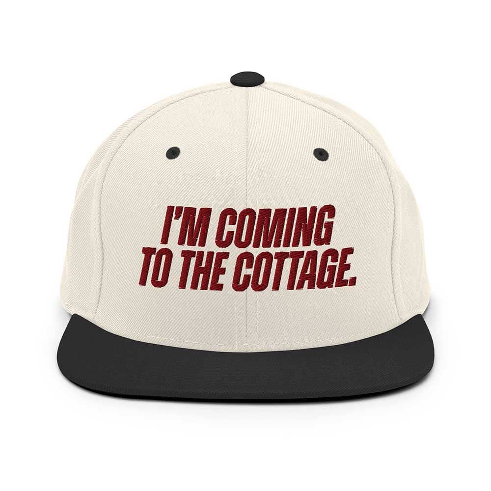 Beige cap with red text 'I'm Coming to the Cottage' on a white background