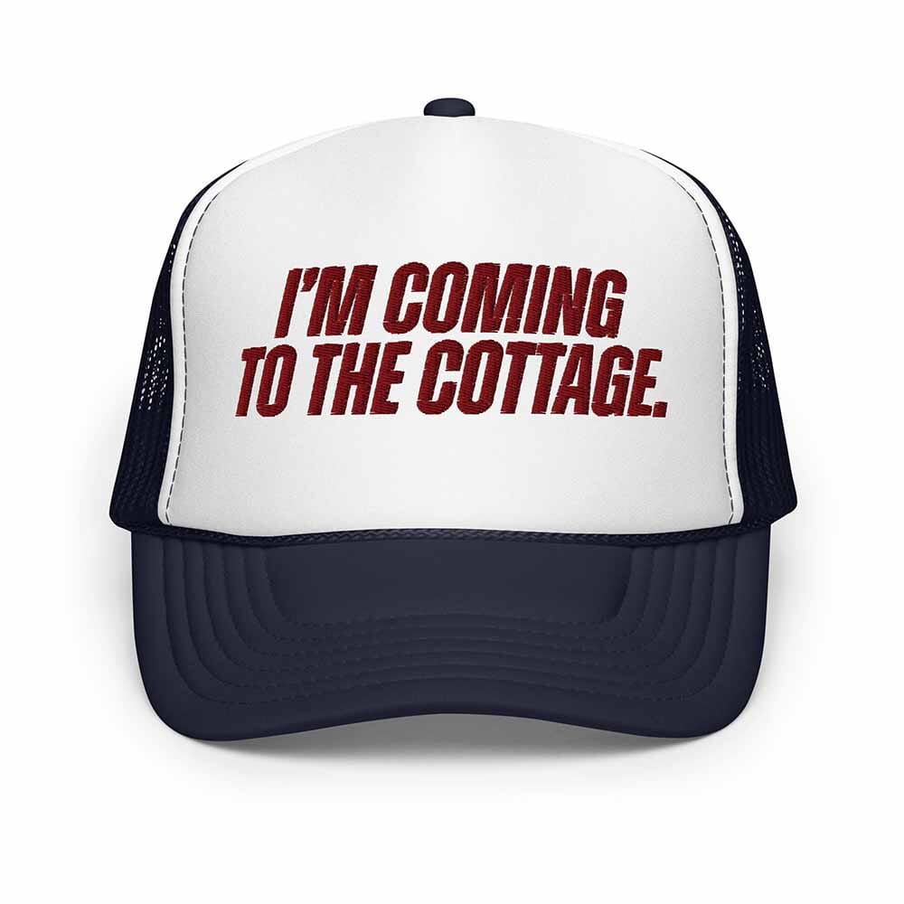 Navy and white Trucker hat with 'I'm Coming to the Cottage' text on a white background