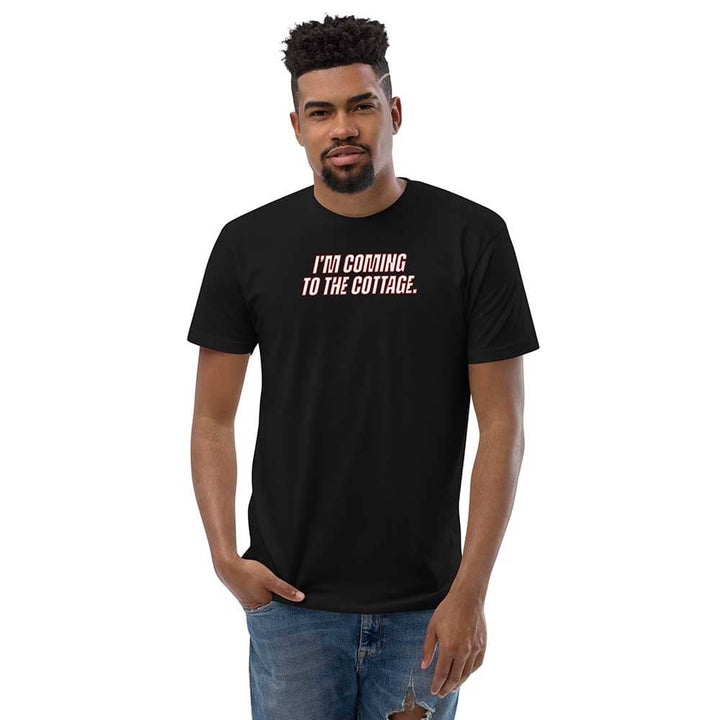 Man wearing a black t-shirt with text on a white background