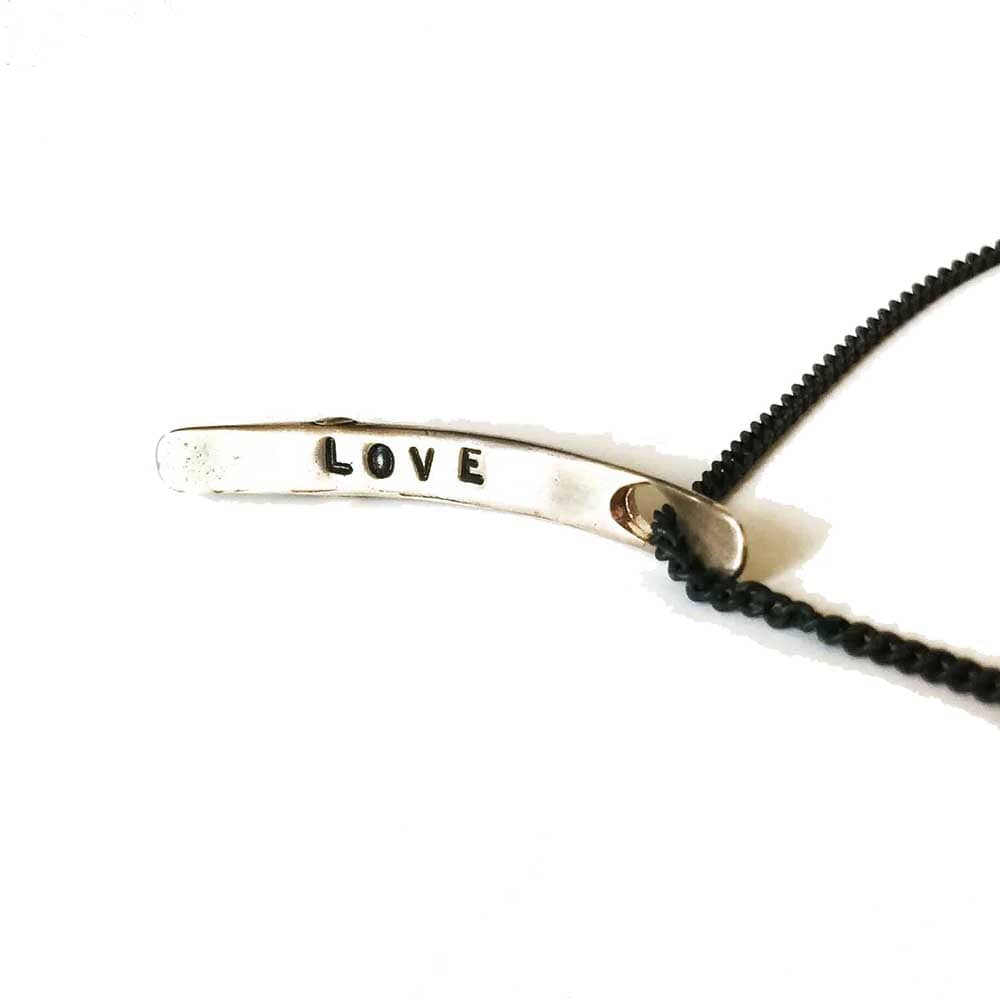 Sliver of a Crescent Moon "Love" Necklace in Bronze
