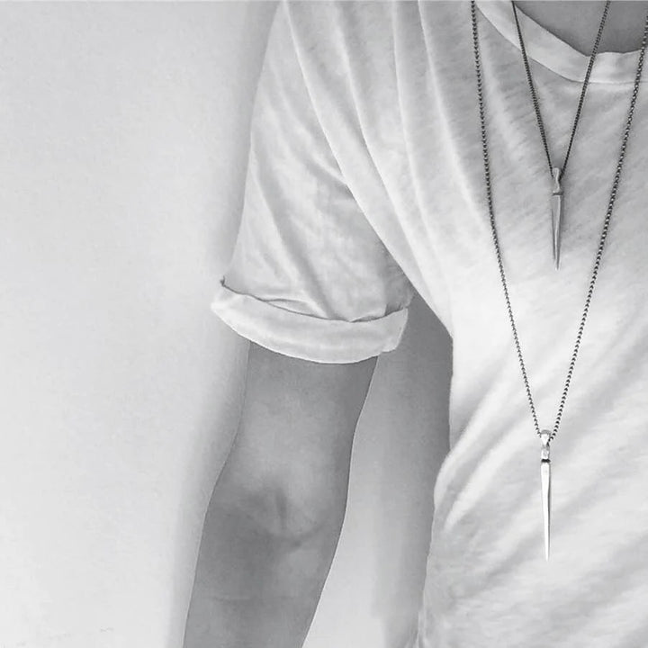 Gladius Sword Necklace in Silver on model in t-shirt layered